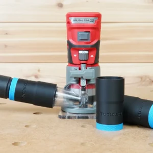 Black and blue ToolCurve hose adapter joining a vacuum hose to a red Craftsman 20v router, with two spare adapters beside it