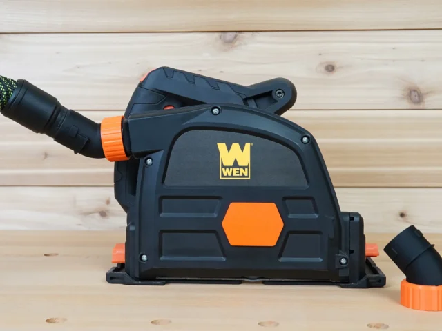 Black and orange no snag dust port attached to a Wen track saw, with removable hose adapters shown separately