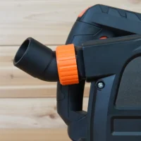 No Snag Dust Port for Wen Track Saw mounted on a Wen track saw, with orange collar and black hose adapter angled upward