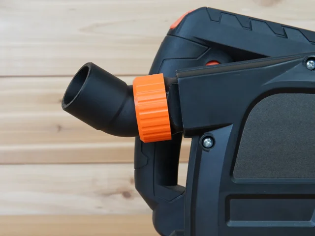 No Snag Dust Port for Wen Track Saw mounted on a Wen track saw, with orange collar and black hose adapter angled upward