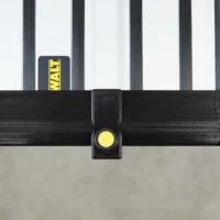 Black plastic hose deflector with yellow clamping knob, mounted on a DeWalt guide rail system