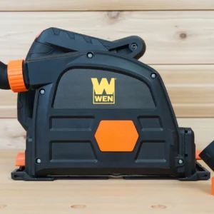 Black no snag dust port with orange threaded collar installed on a Wen track saw, second port beside it