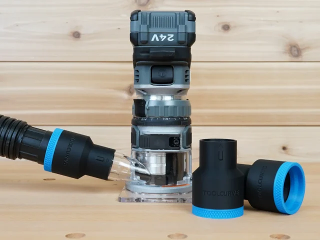 Black ToolCurve 1-7/8 inch hose adapter with blue ring joining a vacuum hose to a FLEX 24v router, plus two spares
