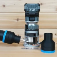 Black 2-1/2 inch hose adapter with blue trim standing beside a FLEX 24v router, second adapter joined to a vacuum hose at the router's dust port