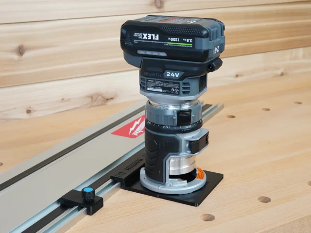 FLEX 24v router attached to guide rail adapter on Festool track saw rail, with orange latch visible on black mounting base