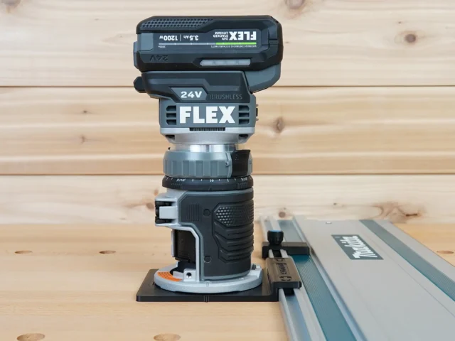 ToolCurve guide rail adapter mounted on FLEX 24v brushless router, connected to aluminum track saw rail on wooden workbench