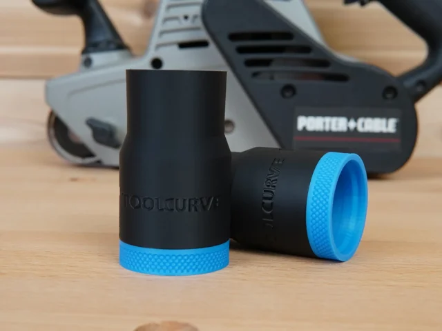 Black ToolCurve hose adapter with blue textured grip band, shown standalone and installed on Porter Cable belt sanders in background