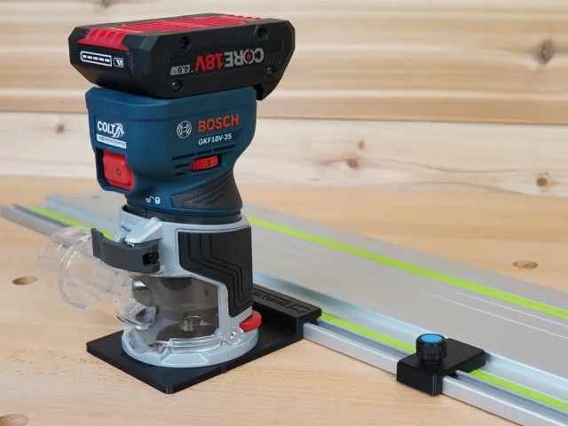 Bosch GFK 18v Colt router mounted on guide rail adapter, positioned on Festool track with green laser line visible