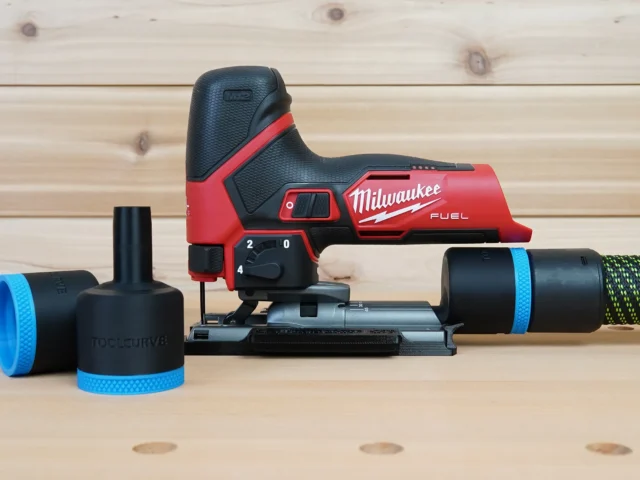 Black 36mm ToolCurve hose adapter parts beside a Milwaukee M12 Fuel jig saw, with hose cuff connected at right
