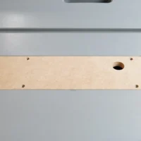 Bosch 4100 table saw zero clearance insert, MDF with rounded corners, four mounting holes and one center opening, shown from above