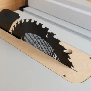MDF zero clearance insert installed in a FLEX 10-inch table saw with blade raised through the kerf slot