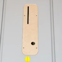 Tan MDF zero clearance insert for Bosch 4100 table saw, shown flat with vertical slot and round opening, mounted with stainless screws
