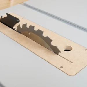 MDF zero clearance insert seated in a Bosch GTS15 table saw with blade raised through the narrow kerf slot