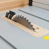 Wood and black plastic zero clearance insert for Bosch 4100 table saw, mounted on saw table with saw blade visible