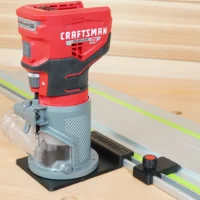 Craftsman 20v router mounted on black adapter base connected to track saw guide rail