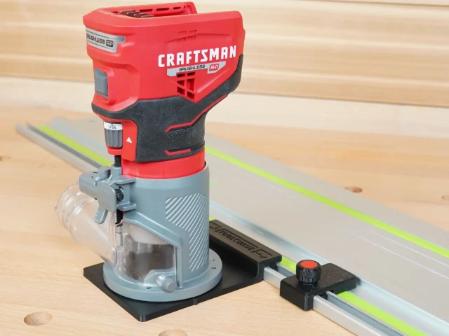 Craftsman 20v router mounted on black adapter base connected to track saw guide rail