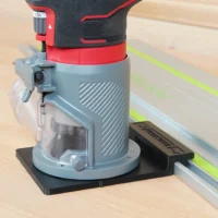 Craftsman 20v router mounted on black adapter base attached to track saw guide rail