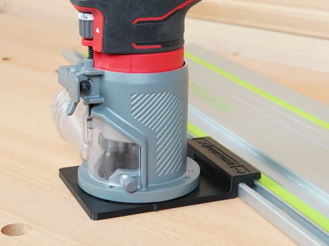 Craftsman 20v router mounted on black adapter base attached to track saw guide rail