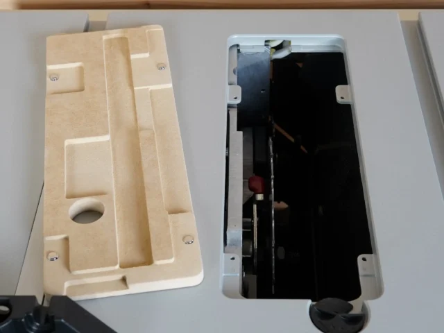 Natural MDF zero clearance insert with routed pockets and mounting holes for Bosch GTS18 table saw, shown left; right shows insert mounted in saw with stainless offset screws visible
