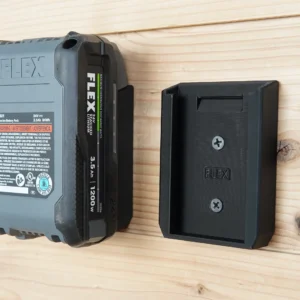 Black FLEX 24v battery wall mount screwed to a pine board, with a FLEX 3.5Ah battery beside it