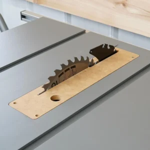 MDF zero clearance insert installed in a gray Ridgid 10-inch table saw with blade and riving knife raised through the slot