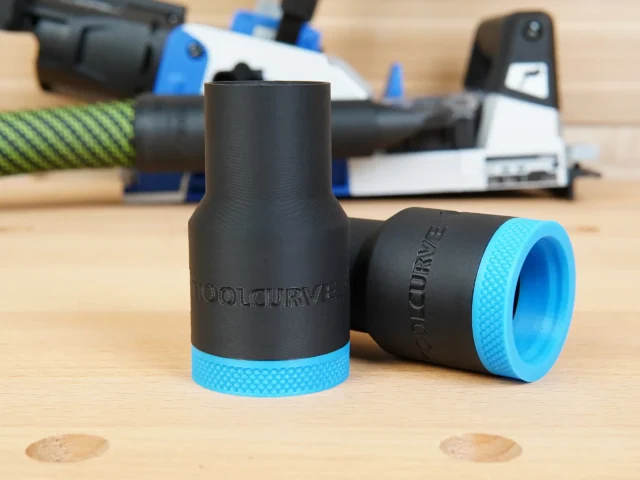 Two black ToolCurve hose adapters with blue textured grip bands, one shown straight-on and one angled, labeled for Kreg Rebel pocket hole joiner