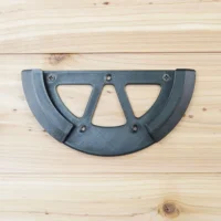 Dark gray gyroid-filled plastic sander holder with two rounded openings and Phillips screw holes, mounted on light wood surface