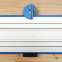 Blue 3D-printed wall mount with knurled locking knob clipped onto a Kreg Accu-Cut guide rail, top view