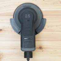 3M Xtract sander mounted in black plastic holder with 2.5 marking, attached to MFT/3 rail, viewed from above on wooden surface