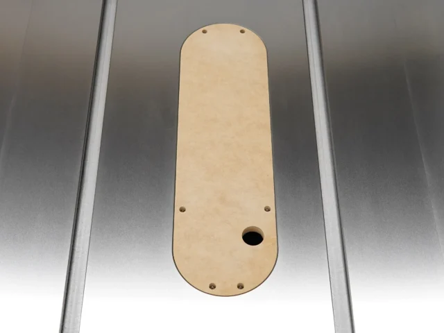 Beige MDF zero clearance insert for SawStop table saw, shown from above with four mounting holes and one center opening