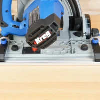 Anti-Tip Guide mounted on Kreg ACS track saw, showing black PETG adapter securing saw to blue guide rail during angled cut setup