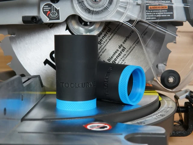 Black ToolCurve hose adapter with blue grip band, displayed on a Ryobi miter saw dust port alongside packaging and documentation