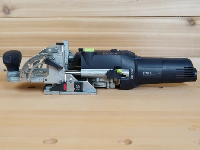 DF 500 Imperial Thickness Gauge mounted on a Festool Domino joiner, showing the numbered dial with imperial board thickness settings and bright green indicator
