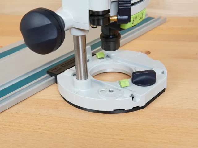 Guide Rail Adapter for 1400 router mounted on Festool track, showing white base plate with central opening and attached router above