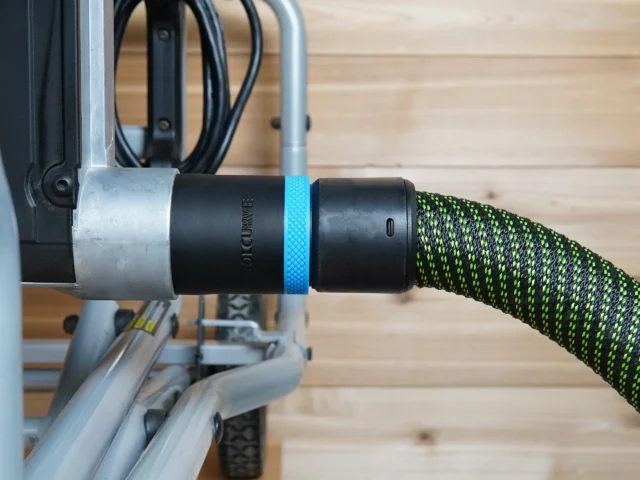 Black 36mm hose adapter with blue band joining a green vacuum hose to a Kobalt table saw dust port