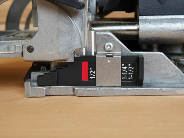 Black stepped imperial thickness gauge marked 1/2" and 1-1/4"/1-1/2" installed on a Festool DF 500 Domino joiner base