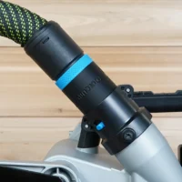 Black hose adapter with blue band attached to Bosch 18v miter saw dust port, green and black rope hose connected above