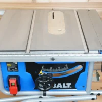 Zero clearance insert installed on Kobalt 10" table saw, showing smooth MDF surface with mounting slots and adjustment screw holes