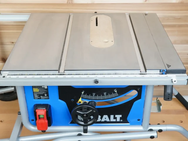 Zero clearance insert installed on Kobalt 10" table saw, showing smooth MDF surface with mounting slots and adjustment screw holes