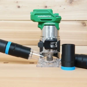 Black ToolCurve hose adapter with blue band joining a vacuum hose to a green Metabo HPT trim router, two spare adapters beside it