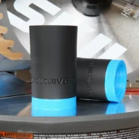 Black and bright blue hose adapter for SKIL 10" miter saw, shown in two orientations on a workbench