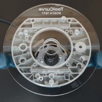 ToolCurve 8-inch round acrylic router base plate for Bosch 1617, top view showing clear acrylic with mounting holes and central router bit opening