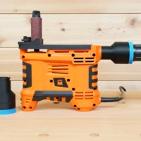Black 1-7/8 inch hose adapter with blue band beside an orange WEN spindle sander, second adapter fitted to its dust port