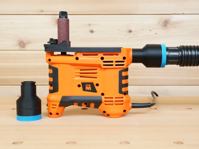 Black 1-7/8 inch hose adapter with blue band beside an orange WEN spindle sander, second adapter fitted to its dust port