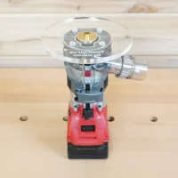 6-inch clear acrylic router base plate mounted on red Milwaukee trim router, shown from above on workbench with pegboard behind