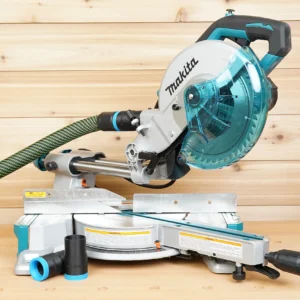 Black and blue ToolCurve hose adapter joining a dust hose to a Makita LS miter saw port, spare adapters below