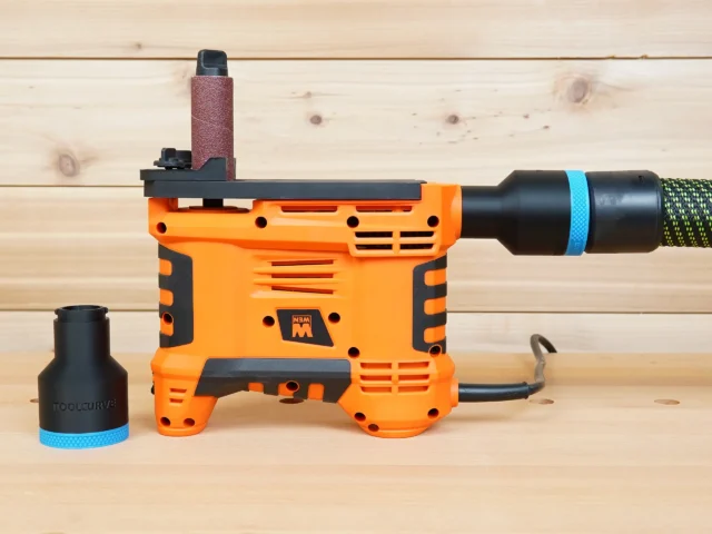 Black 36mm hose adapter with blue collar shown beside an orange WEN spindle sander connected to a vacuum hose