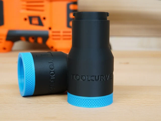 Black cylindrical hose adapter with blue grip rings, labeled ToolCurve, displayed upright with a second adapter lying on its side