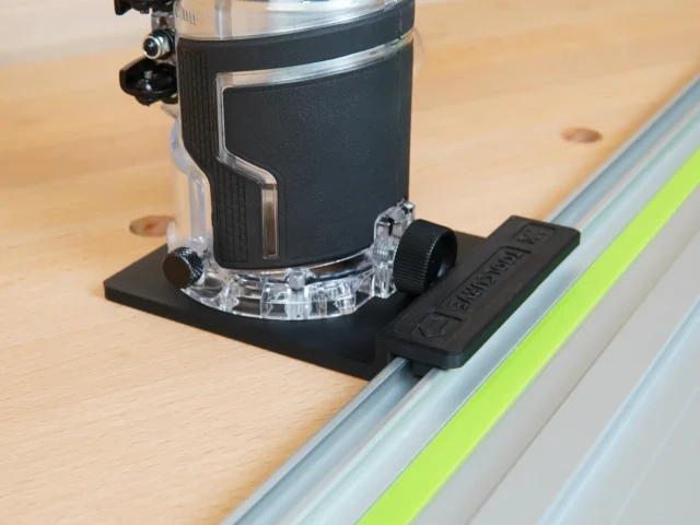 Metabo HPT cordless trim router mounted on black rail adapter connected to Festool guide rail