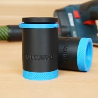 ToolCurve hose adapter for Bosch 12V MAX EC Brushless Planer with blue band and black body, shown alone and installed on tool in background